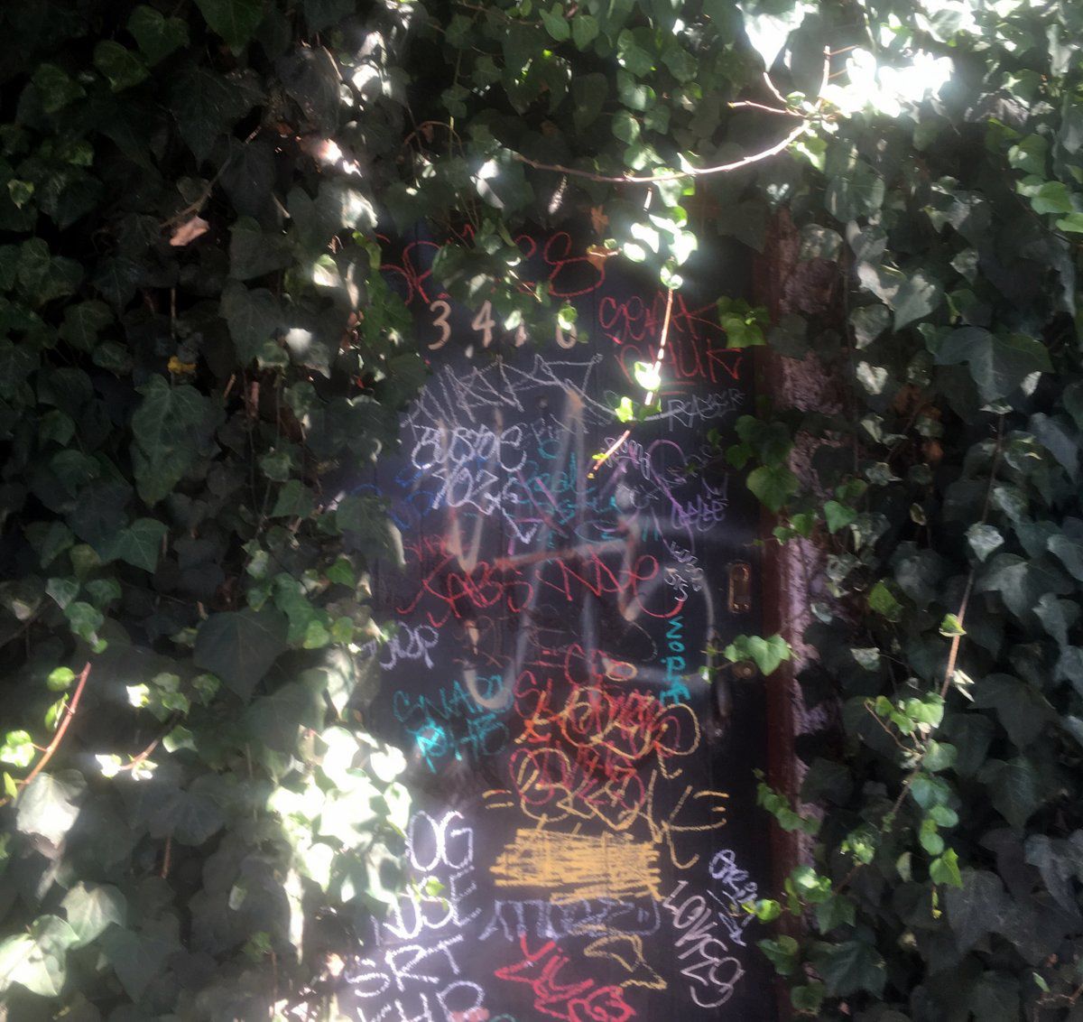 Tagged up front door of 3416 Verdugo the site of a planned restaurant
